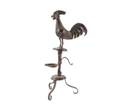 null Wrought-iron rooster oil lamp, tripod base.
H. 33 cm