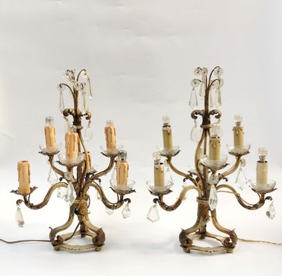 null Pair of gilded metal girandoles with six arms of light adorned with pendants...