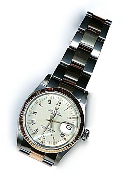 null ROLEX Oyster perpetual date just or et acier Référence 1505 

Fond crème, chiffres...