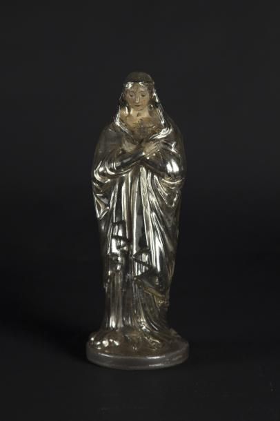 Vierge Vierge en verre églomisé.

Epoque XIXe siècle.

H. : 29 cm.