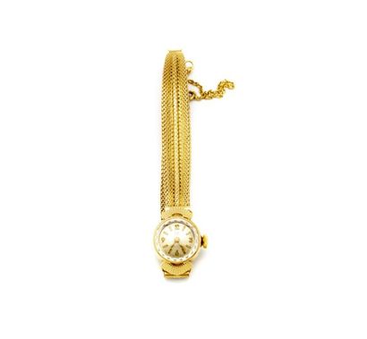 null Montre de dame en or jaune vers 1950 le bracelet formant ruban fermoir à boucle...