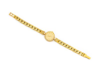 null CARAL
Montre de dame en or jaune 18K (750 millièmes) sertie sur le tour et l'épaulement...