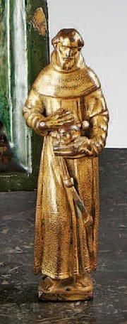 null Saint François d'Assise en bronze doré et ciselé. Debout, les pieds nus, revêtu...