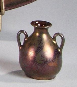 Delphin MASSIER (1836-1907) Vase miniature en faïence à anses latérales détachées,...