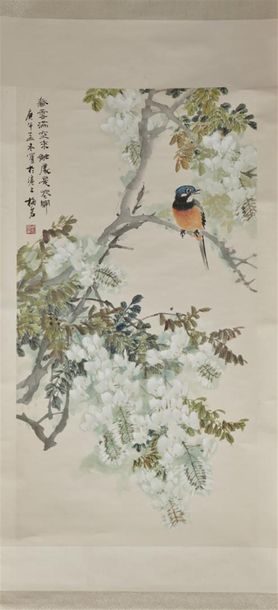 null CHINE, XXe siècle 
Encre et couleurs sur papier représentant un oiseau perché...