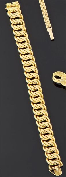 null Bracelet articulé en or jaune 750 millièmes, les maillons entrelacés. (Petites...