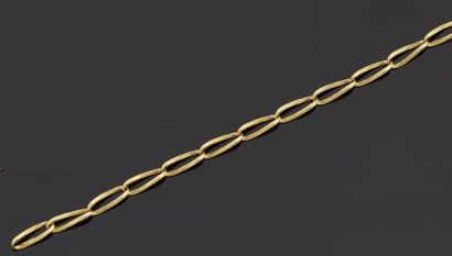 null Bracelet articulé en or jaune 750 millièmes, les maillons ajourés et gravés...