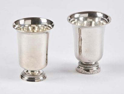 null Two tulip-shaped timpani cups in plain silver 950 thousandths, resting on a...