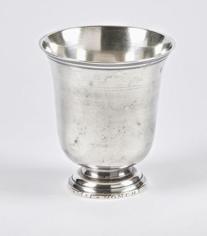 null Solid silver tulip-shaped cup with threaded neck. It rests on a pedestal engraved...