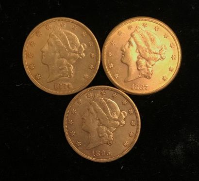 null ** Trois pièces de 20 dollars Liberty en or jaune 1884, 1887, 1895 
Frais de...