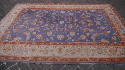 null Large antique Turkish SMYRNE carpet, on a sky blue background with large flowered...