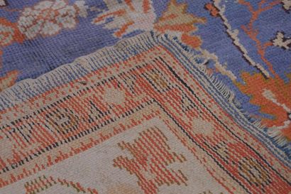 null Large antique Turkish SMYRNE carpet, on a sky blue background with large flowered...