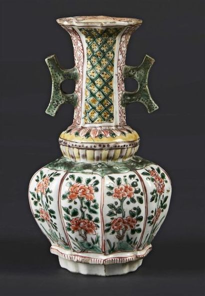 null CHINA 
Baluster-shaped porcelain vase with ribbed wall and two handles on the...