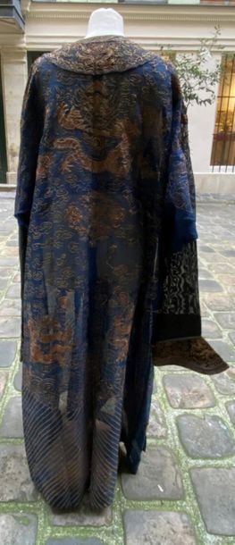 null CHINA 
Gas mandarin dress with blue background with gold thread embroidered...