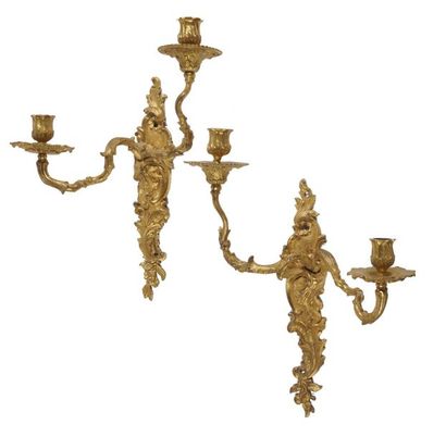 null Pair of two-branched gilt bronze light arms with asymmetrical decoration of...