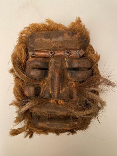 null Set of ethnic objects, including: 
- Ivory Coast, Healed Mask made of carved...