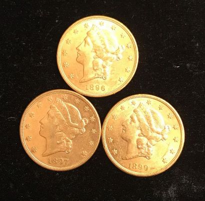 null ** Trois pièces de 20 dollars Liberty en or jaune 1896, 1897, 1899 
Frais de...