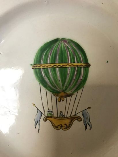 null EAST - Two earthenware plates with polychrome decoration of a hot-air balloon...