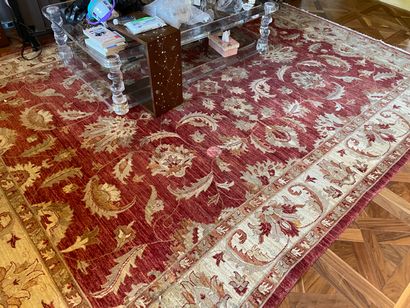 null PAKISTAN 

Carpet with an old red abrasive background decorated with large floral...