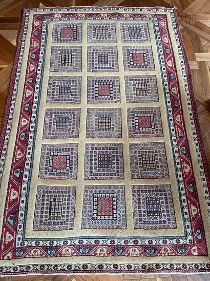 null SIRJAN 

Carpet decorated with multiple multi-coloured squares on a gold background,...