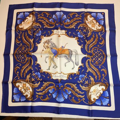 null HERMES Paris 

Silk square titled "Cheval Truc" small blue and white borders...