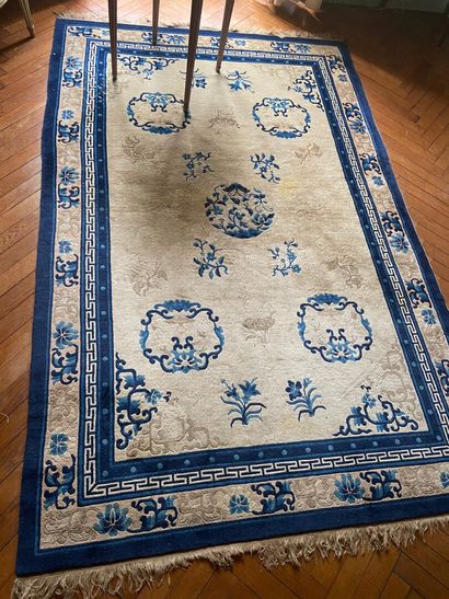 null CHINA 

Wool carpet with blue floral decoration on a cream background.

20th...