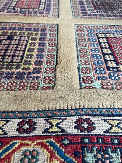 null SIRJAN 

Carpet decorated with multiple multi-coloured squares on a gold background,...