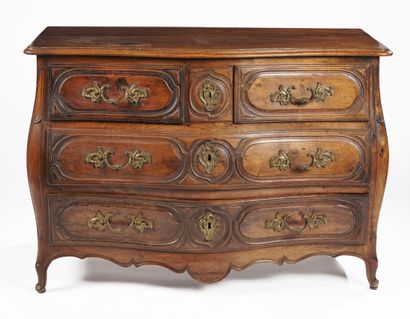 null A walnut chest of drawers, moulded in front and on the sides, opening with four...