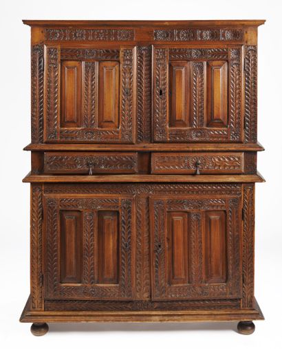 null Carved walnut sideboard with four doors and two drawers, decorated with palmettes...