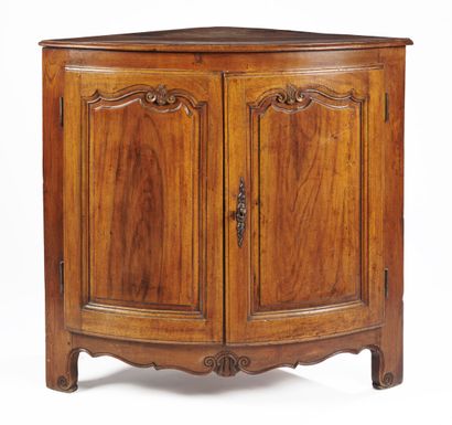 null Large oak and walnut molded and carved corner opening with two leaves, panelled...