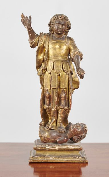 null Figure of a Saint trampling a heretic, in painted and gilded wood; (accidents).

18th...