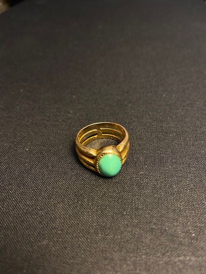 null Yellow gold ring 750 thousandths openwork, the center decorated with a turquoise...