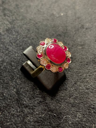 null Yellow gold ring 750 thousandths decorated in the center of a ruby treated of...