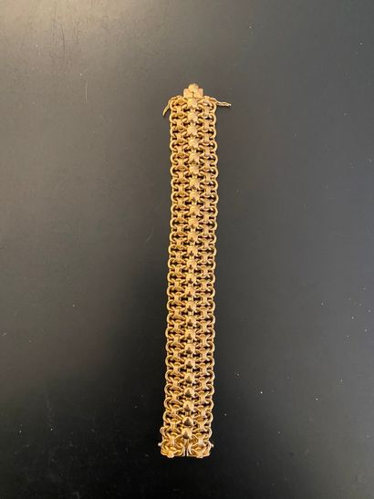 null Articulated bracelet in yellow gold 585 thousandths, the openwork links decorated...