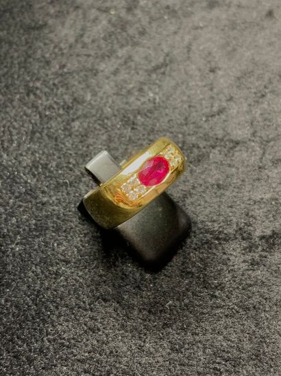 null Yellow gold ring 750 thousandths decorated in the center of a ruby of oval form...