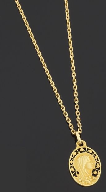 null Necklace articulated in yellow gold 750 thousandths holding in pendant a medal...