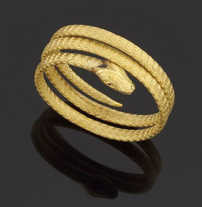 null Bracelet souple à enroulement en or jaune 750 millièmes tressé figurant un serpent.

(Traces...