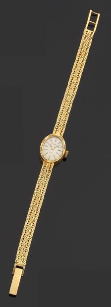 null Bracelet watch of lady in yellow gold 750 thousandths, the watch of round form,...