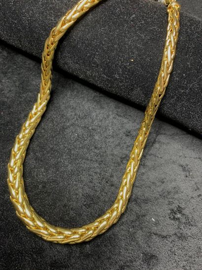 null Collier articulé en or jaune 750 millièmes à décor de tresses en chute.

Longueur...