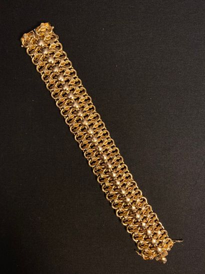 null Articulated bracelet in yellow gold 585 thousandths, the openwork links decorated...