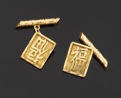 null Pair of cufflinks in yellow gold 750 thousandth, the ends of bamboo shape or...
