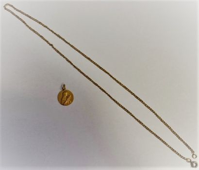 null A MEDAL and a chain in 18k yellow gold (750°/oo). 

Total weight : 8,3 g