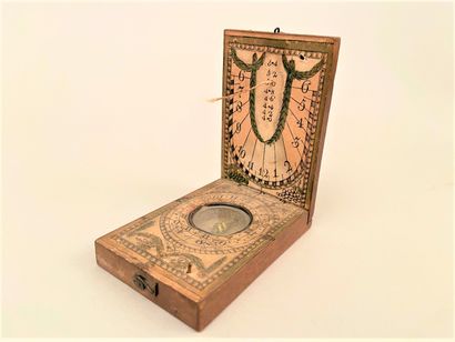 null GERMANY

Wooden compass forming a sundial with stamped decoration on maroufflé...