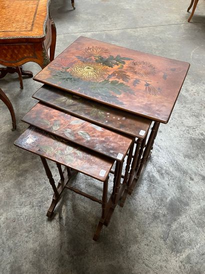 null FOUR polychrome wood nesting tables with floral decoration. 

The largest :...