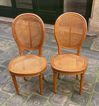 null SEVEN WOODEN CHAIRS, medallion back and cane seat, round tapered front legs...