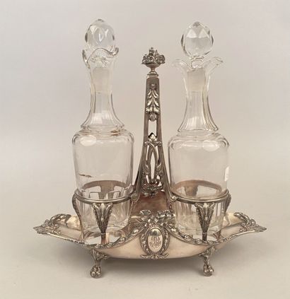 null A silver oiler 950 mililimes of navette form standing on four claw feet with...