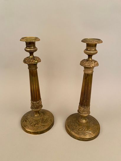 null Pair of brass corkscrews, the baluster-shaped shaft resting on a circular base...