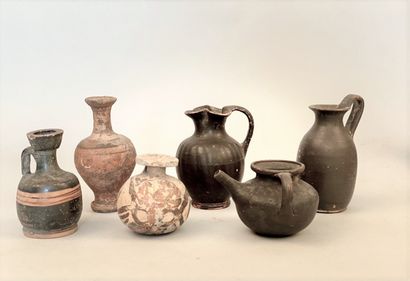 null SET including three black glazed pots, one with a corolla neck and three vases,...