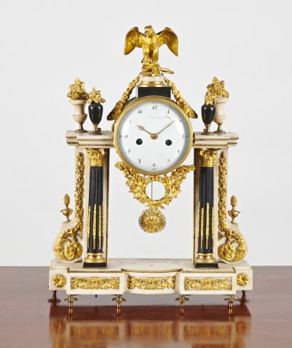 null A white marble, black marble and ormolu portico clock, with two columns surmounted...
