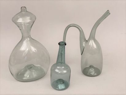 null SET in green translucent blown glass including: 

- a bottle in the shape of...